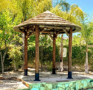 Example: 10.5 ft African Reed Tiki Hut/ Palapa, Options: Canyon Brown stain, Palapa stand, Rope Kit.